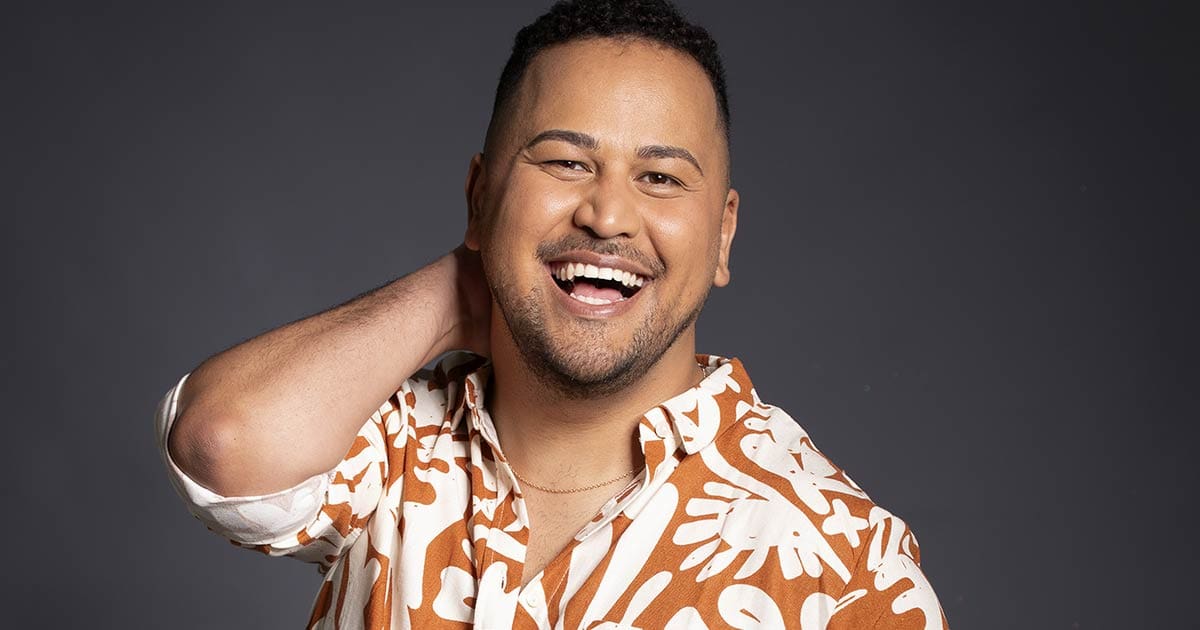 A photo of the multi-talented queer filmmaker Renaldo Schwarp, smiling at the camera